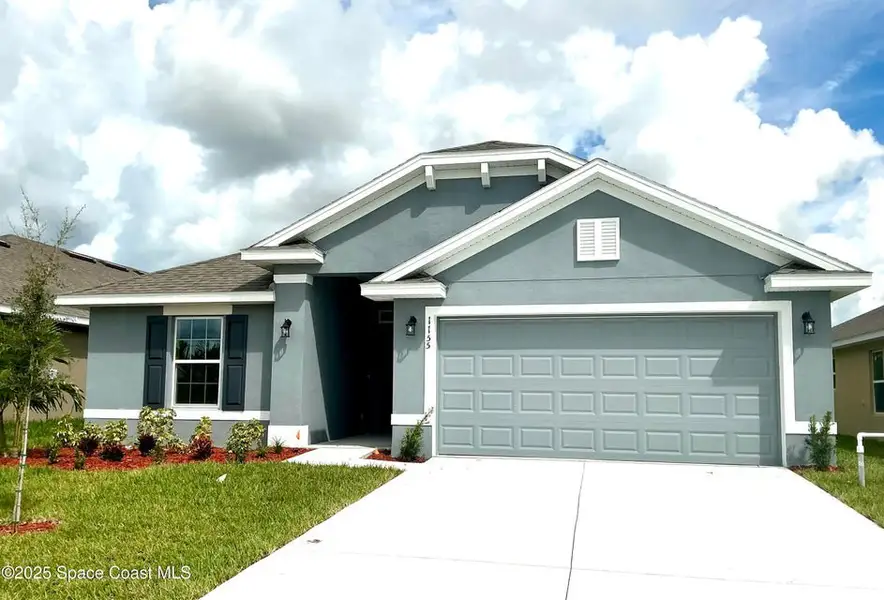 Front exterior of a new home in St. John Preserve, Palm Bay, FL, highlighting curb appeal (Image 1). Front exterior of a new home in St. John Preserve, Palm Bay, FL, highlighting curb appeal (Image 1).