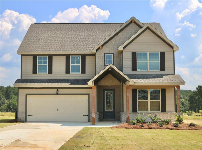 Front exterior of a new home in , Bonaire, GA, highlighting curb appeal (Image 1). Front exterior of a new home in , Bonaire, GA, highlighting curb appeal (Image 1).