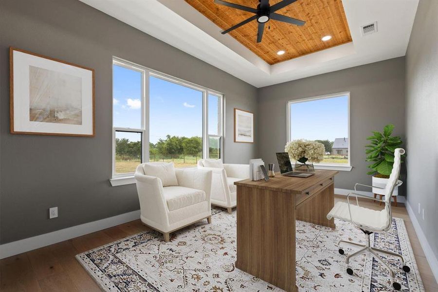 Office with a tray ceiling, wood ceiling, light wood-
style flooring, recessed lighting, and a ceiling fan Office with a tray ceiling, wood ceiling, light wood-
style flooring, recessed lighting, and a ceiling fan