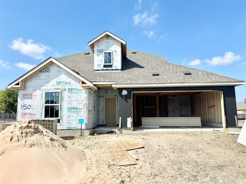 Property under construction featuring a shingled roof Property under construction featuring a shingled roof