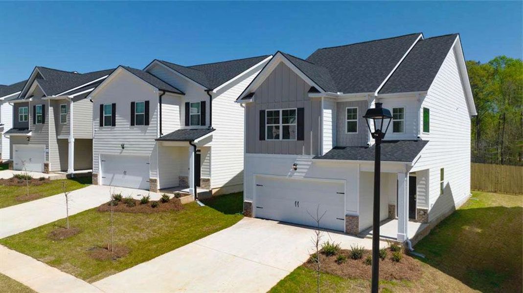 Front exterior of a new home in Shoal Creek, Hampton, GA, highlighting curb appeal (Image 16).