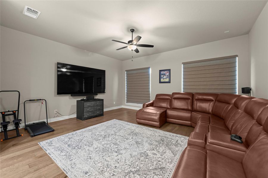 Hardwood floors and a welcoming ceiling fan complement this comfortable living space. Hardwood floors and a welcoming ceiling fan complement this comfortable living space.