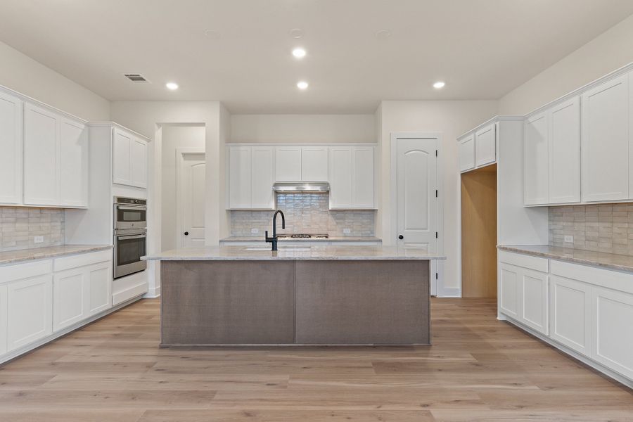 Representative furnished interior of a home built from the Waterville by Ashton Woods in The Trails at Carmel, Pflugerville (Image 7).