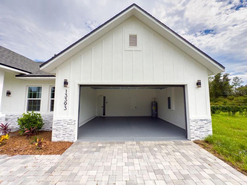 Front exterior of a new home in , Ocala, FL, highlighting curb appeal (Image 1).