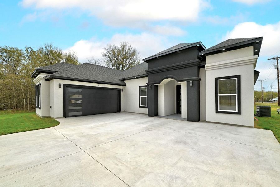 Front exterior of a new home in , Bastrop, TX, highlighting curb appeal (Image 24).