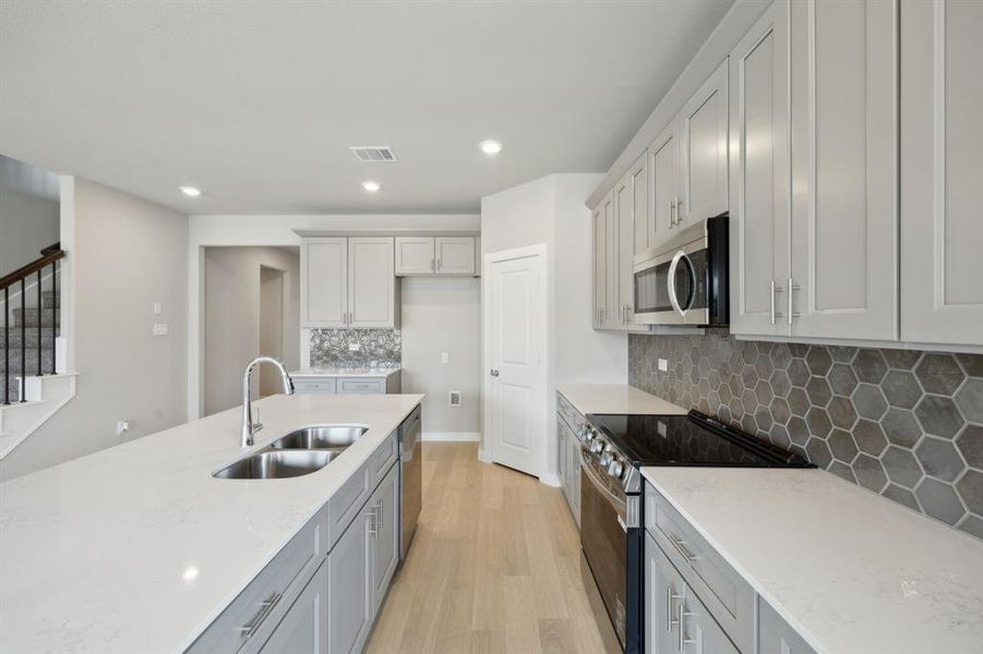 Here you can see the beautiful backsplash and the large island