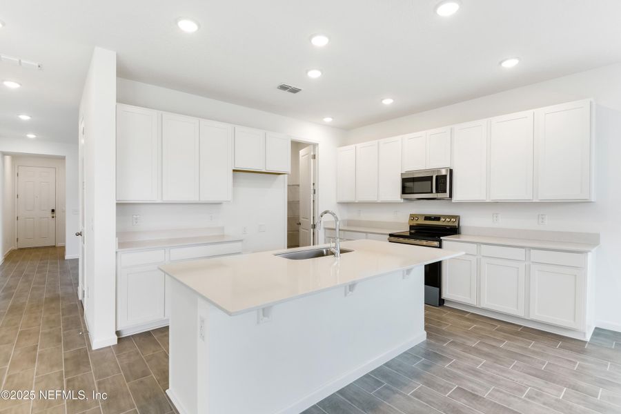 Furnished interior view inside a new home in Seasons at Grandview Gardens, Deland (Image 6).