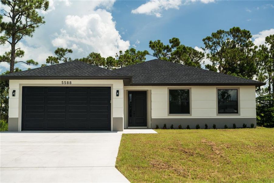 Front exterior of a new home in , North Port, FL, highlighting curb appeal (Image 18).