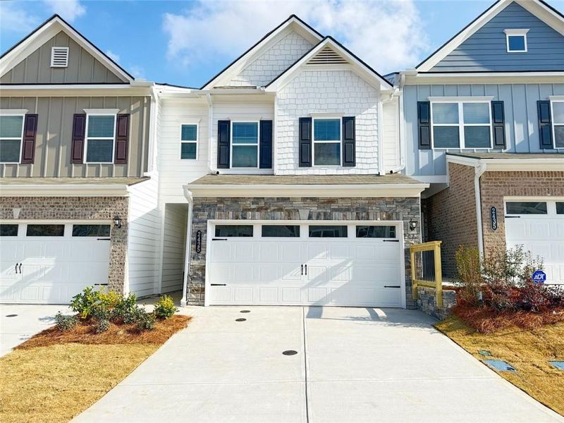 Front exterior of a new home in Sanders Park, Austell, GA, highlighting curb appeal (Image 1).