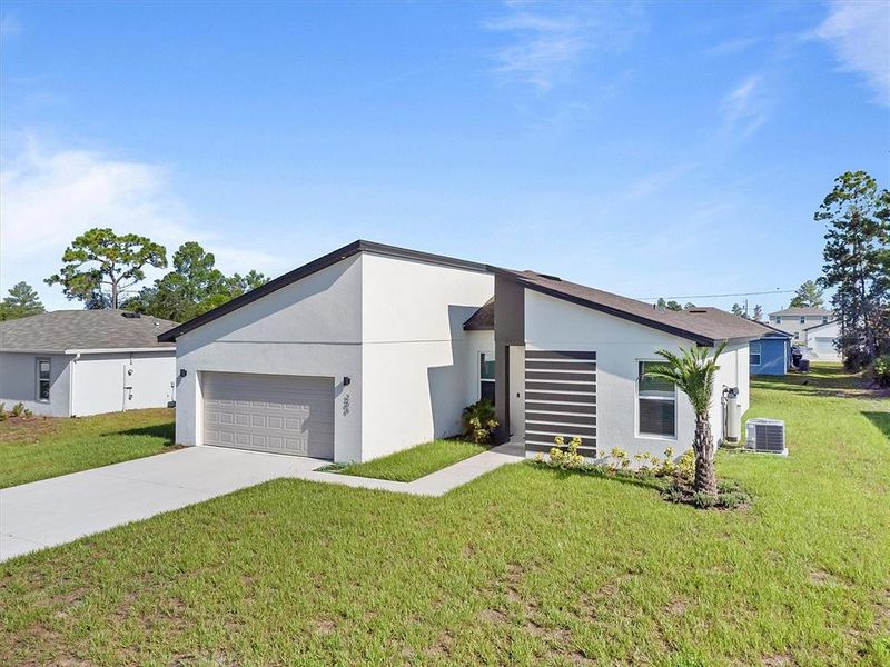 Front exterior of a new home in , Kissimmee, FL, highlighting curb appeal (Image 18).