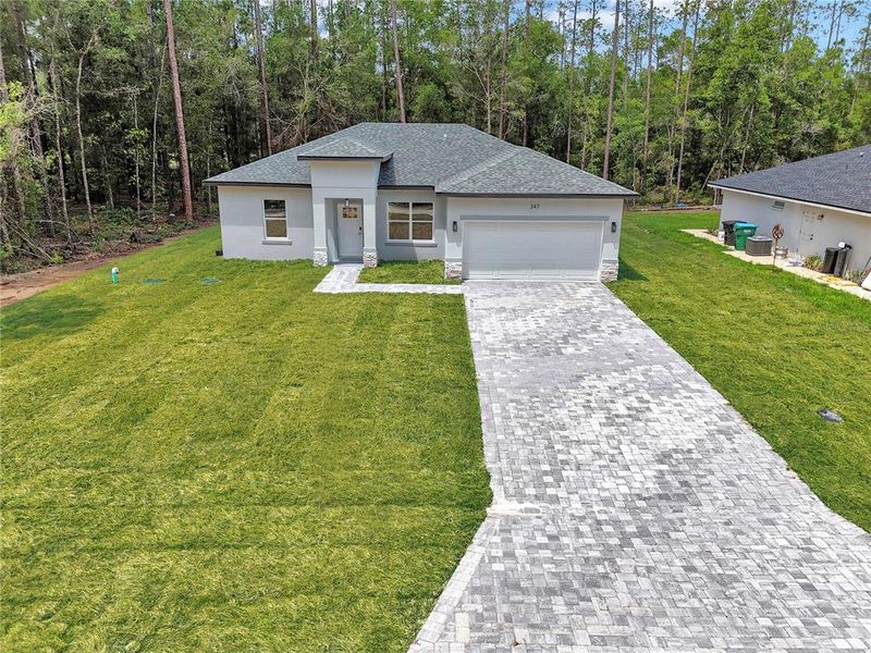 Front exterior of a new home in , Citrus Springs, FL, highlighting curb appeal (Image 2). Front exterior of a new home in , Citrus Springs, FL, highlighting curb appeal (Image 2).