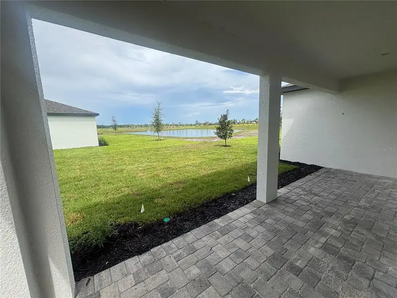 Exterior details and patio area of a home in Coasterra, Palmetto (Image 17).