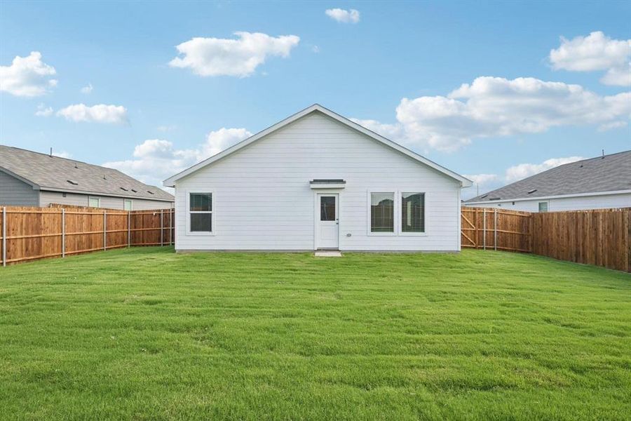 Expansive backyard featuring a manicured lawn Expansive backyard featuring a manicured lawn