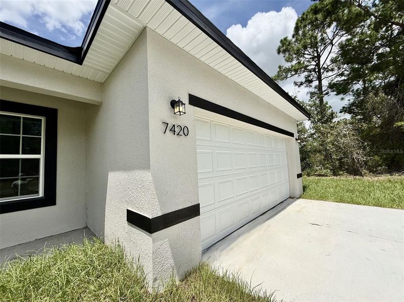 Front exterior of a new home in , Citrus Springs, FL, highlighting curb appeal (Image 19).