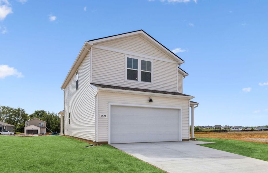 Front exterior of a new home in Highlands of Carter's Station, Columbia, TN, highlighting curb appeal (Image 19).