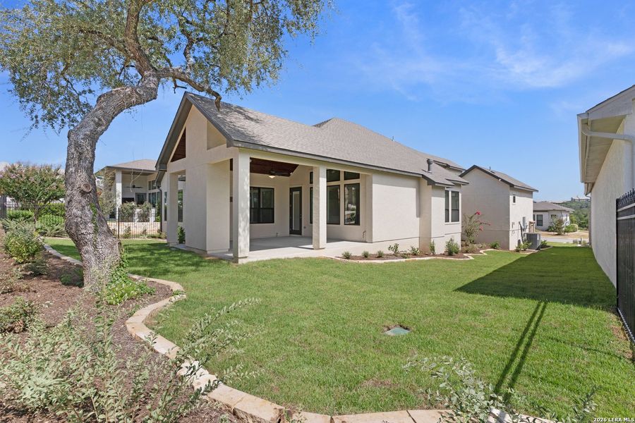 Exterior details and patio area of a home in El Sonido at Campanas, San Antonio (Image 22).