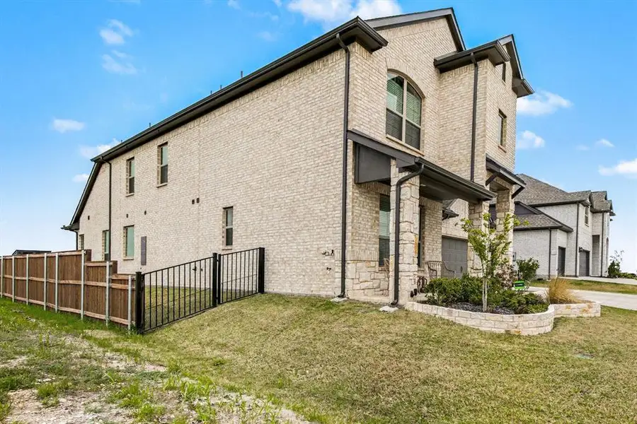 Exterior details and patio area of a home in Silo Mills, Joshua (Image 3).