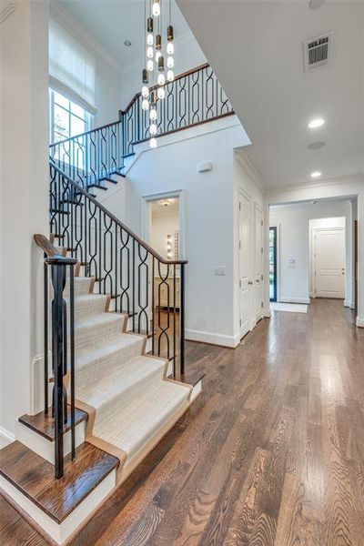 Staircase with stunning vintage light fixture