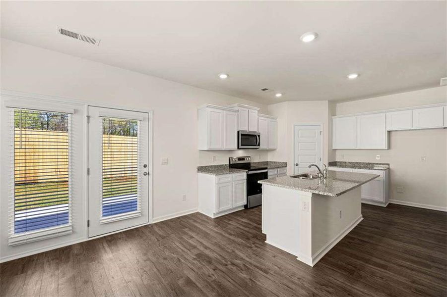 Furnished interior view inside a new home in Oakchase at Hampton, Hampton (Image 9).
