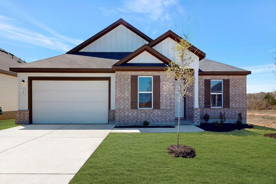 Front exterior of a new home in Carillon, Manor, TX, highlighting curb appeal (Image 20).