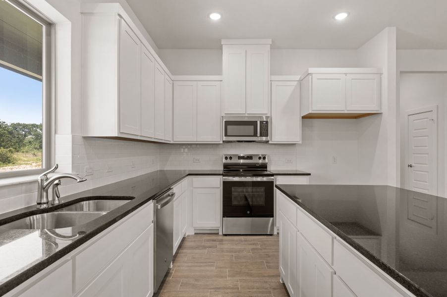 Furnished interior view inside a new home in Saddleback Estates, Boyd (Image 7).