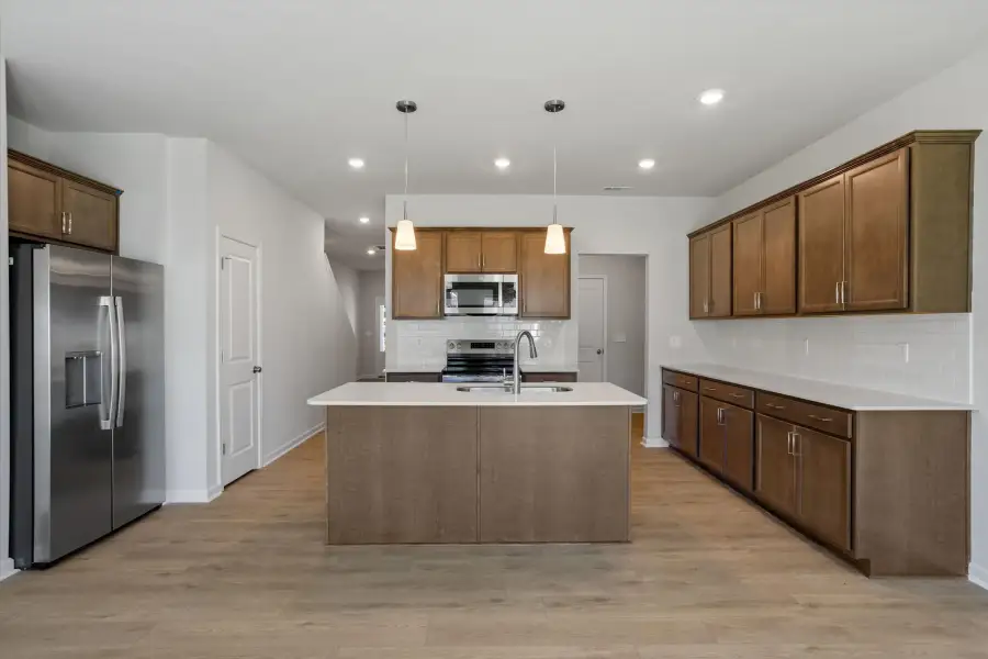 Furnished interior view inside a new home in West Main Townhomes, Sanford (Image 6).