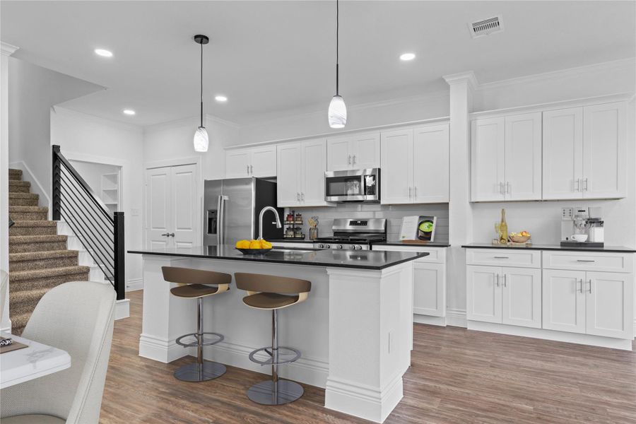 This new home’s gourmet kitchen features an upgraded stainless-steel 5-burner gas range and a built-in stainless microwave oven. Take a look at all the beautiful cabinetry and generous countertop space surrounding you, perfect for cooking and entertaining. Make that call today to see this amazing home just minutes from the lake! *Virtually staged* This new home’s gourmet kitchen features an upgraded stainless-steel 5-burner gas range and a built-in stainless microwave oven. Take a look at all the beautiful cabinetry and generous countertop space surrounding you, perfect for cooking and entertaining. Make that call today to see this amazing home just minutes from the lake! *Virtually staged*