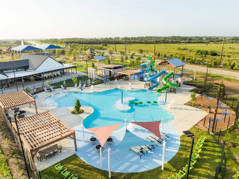 Aerial view of the community pool and surrounding recreation area. Aerial view of the community pool and surrounding recreation area.