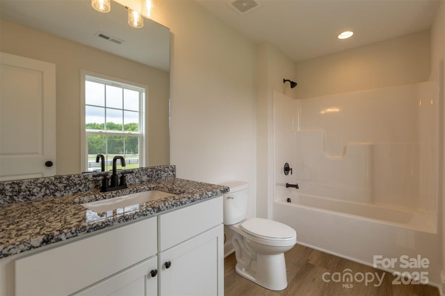 private bath in an upstairs bathroom