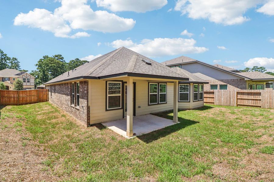 Front exterior of a new home in Montgomery Oaks - Estate, Conroe, TX, highlighting curb appeal (Image 1).