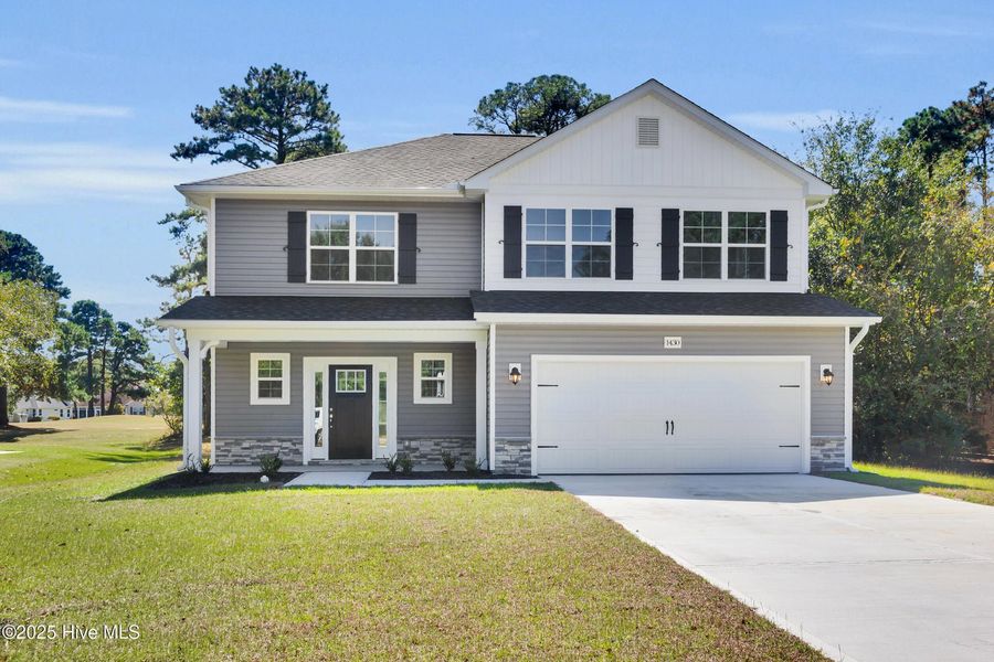 Front exterior of a new home in Fairfield Harbour, New Bern, NC, highlighting curb appeal (Image 1).