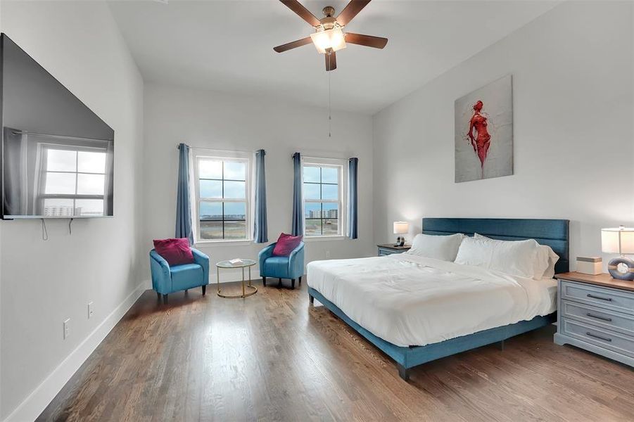 Bedroom featuring wood finished floors and ceiling fan