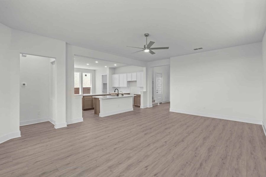 Representative unfurnished interior of a home built from the Maddie by Chesmar Homes in Stillwater Ranch, San Antonio (Image 7).