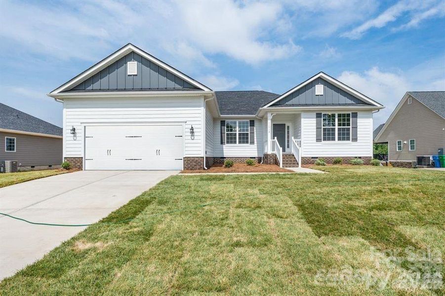 Front exterior of a new home in Cardiff Glyn, Catawba, NC, highlighting curb appeal (Image 2). Front exterior of a new home in Cardiff Glyn, Catawba, NC, highlighting curb appeal (Image 2).