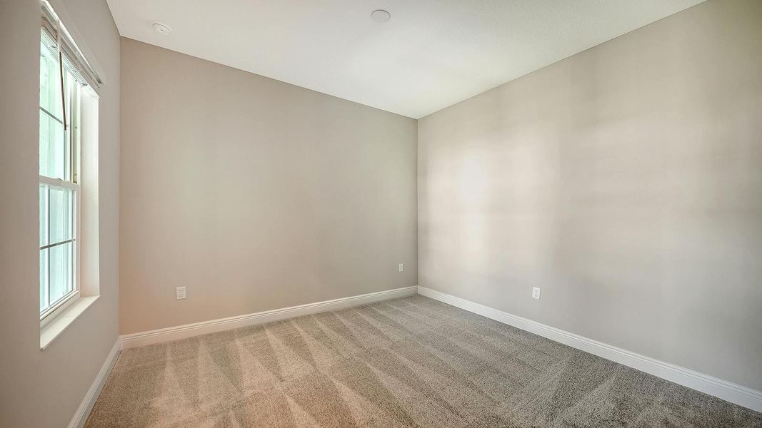 Spacious, unfurnished interior of a new home in Wildleaf Real Estate and Homes for Sale in Parrish, FL - Neal Communities, Parrish (Image 32).