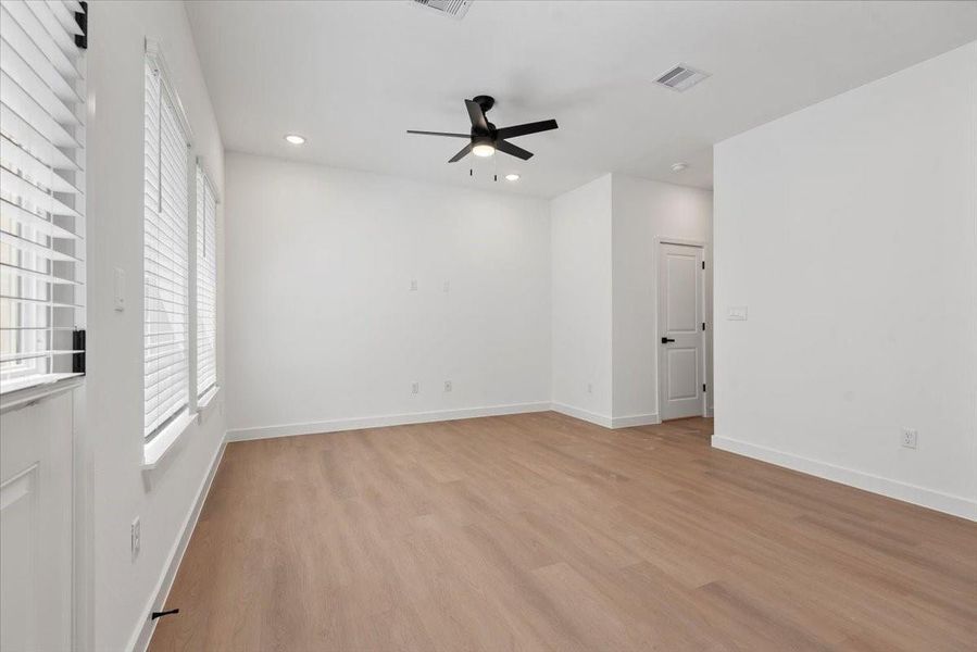 Living room offers generous natural light and a spacious feel from every angle. Living room offers generous natural light and a spacious feel from every angle.