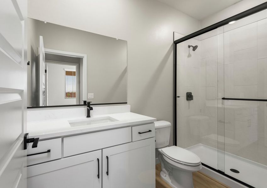 Secondary bathrooms feature luxurious details.