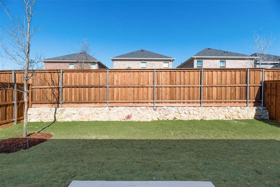 Exterior details and patio area of a home in Spiritas Ranch, Little Elm (Image 4).