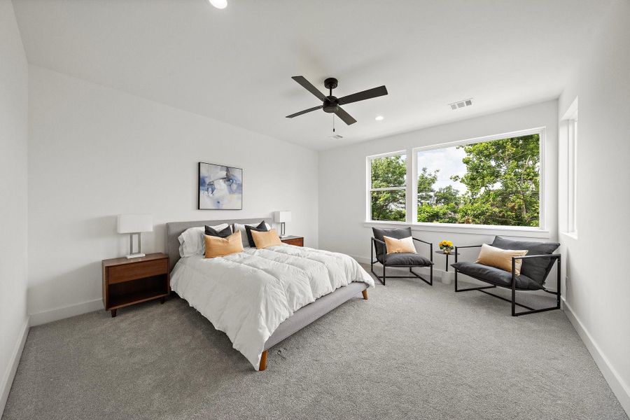 The generously sized primary bedroom offers an abundance of natural light, creating a bright and welcoming retreat.**Images shown are from a similar model. Actual features may vary. The generously sized primary bedroom offers an abundance of natural light, creating a bright and welcoming retreat.**Images shown are from a similar model. Actual features may vary.