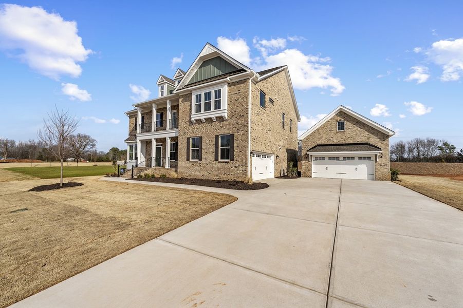 Front exterior of a new home in Walnut Grove, Easley, SC, highlighting curb appeal (Image 2). Front exterior of a new home in Walnut Grove, Easley, SC, highlighting curb appeal (Image 2).