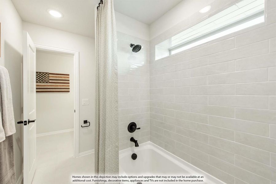 Bathroom with white subway tile tub surround, curtain, and black fixtures with a small window above