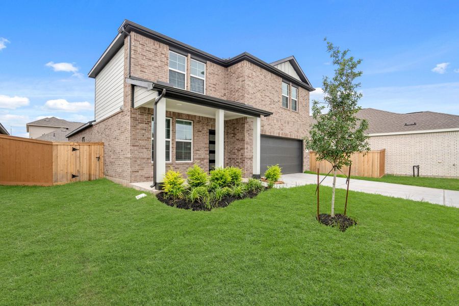 Exterior details and patio area of a home in Sunterra, Katy (Image 16).