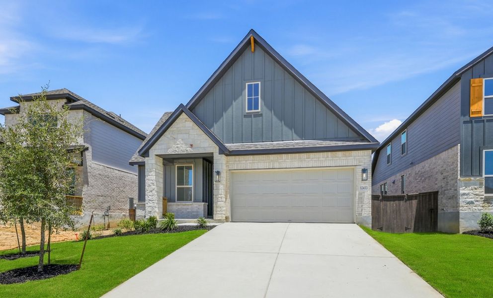 Front exterior of a new home in Bison Ridge, San Antonio, TX, highlighting curb appeal (Image 1). Front exterior of a new home in Bison Ridge, San Antonio, TX, highlighting curb appeal (Image 1).