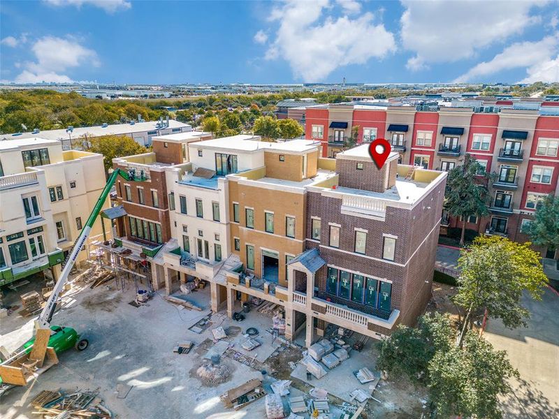 Aerial view of Phase 1 and Residence #110 with Rooftop and 2nd floor balcony, and extra parking in front of garage.