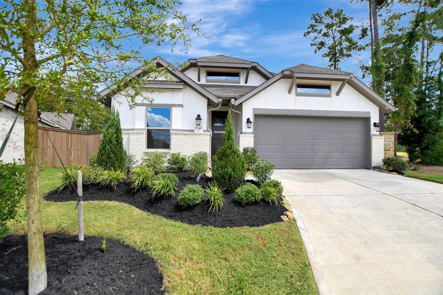 Front exterior of a new home in The Highlands, Porter, TX, highlighting curb appeal (Image 25).