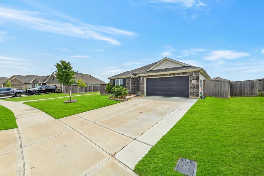 Front exterior of a new home in Ambrose, La Marque, TX, highlighting curb appeal (Image 21).