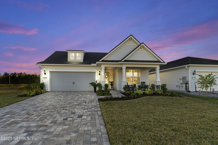 Front exterior of a new home in Summer Bay at Grand Oaks, St. Augustine, FL, highlighting curb appeal (Image 25).