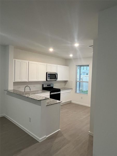 Furnished interior view inside a new home in Decker Farms, Magnolia (Image 7).