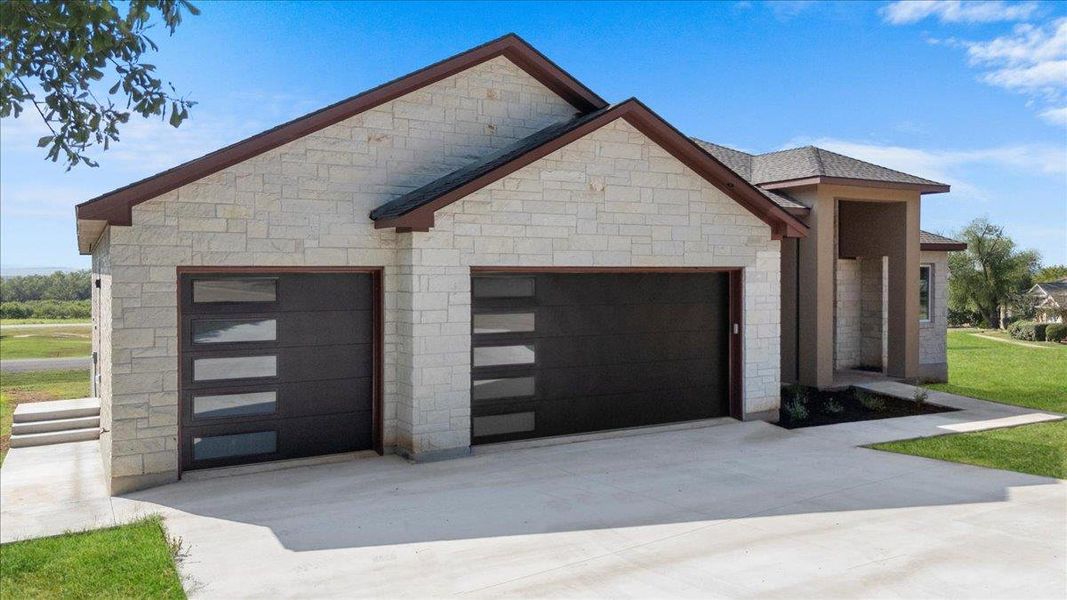 Front exterior of a new home in , Bastrop, TX, highlighting curb appeal (Image 2). Front exterior of a new home in , Bastrop, TX, highlighting curb appeal (Image 2).