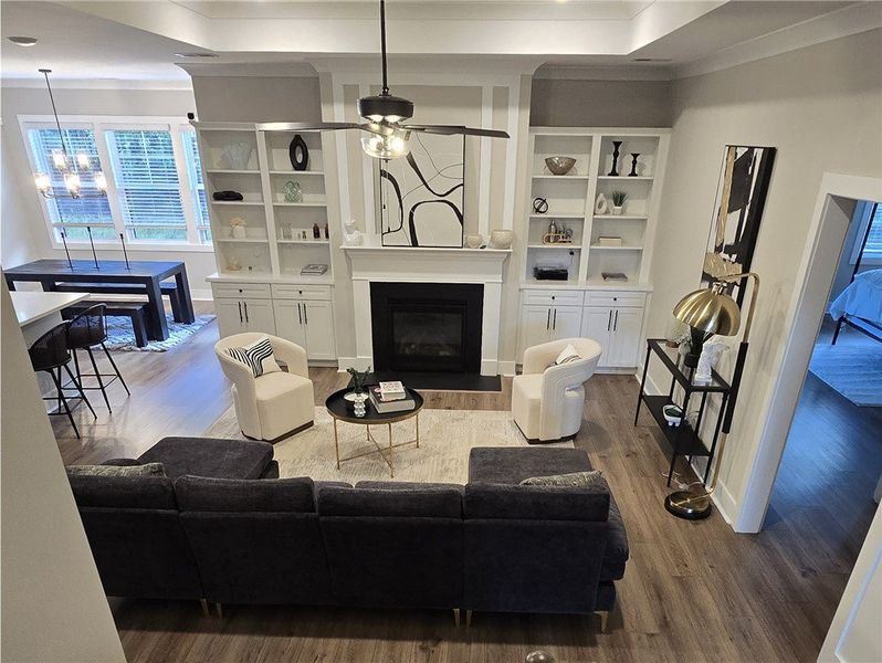 An inviting great room with built-in shelving and An inviting great room with built-in shelving and